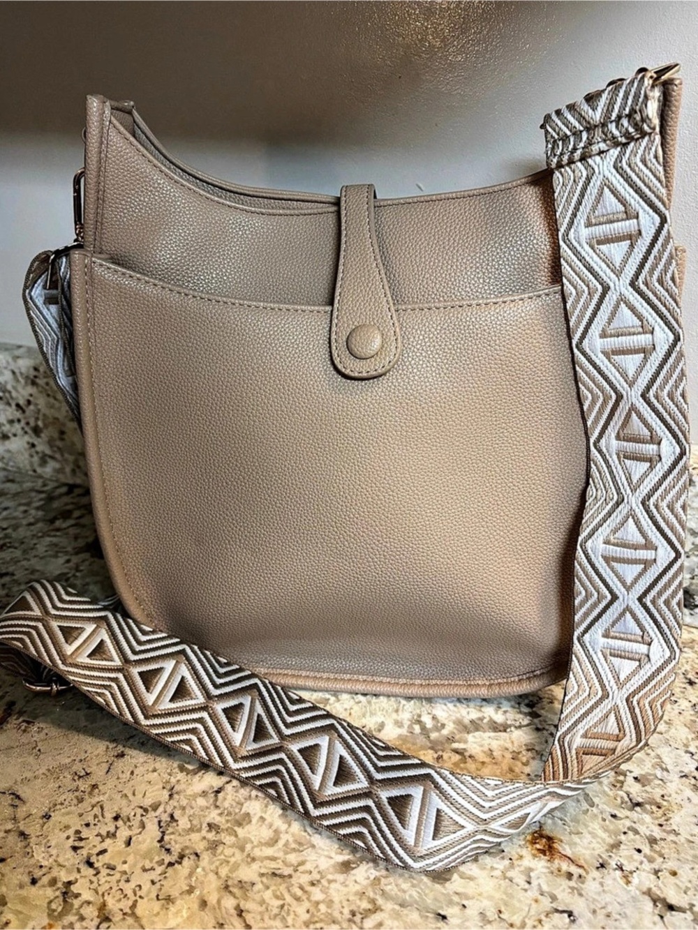 Ah-dorned Faux leather messenger crossbody bag.